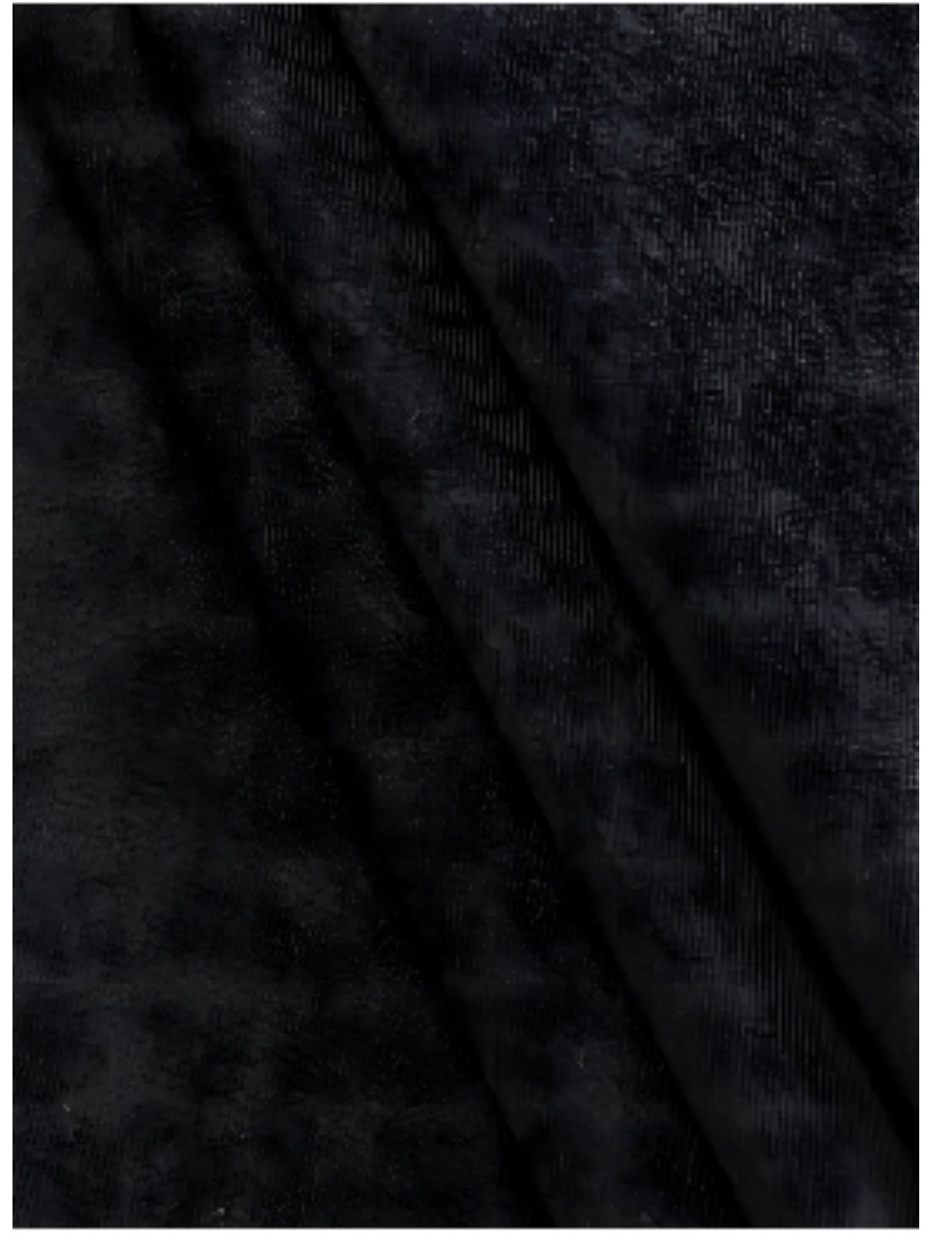 Close-up black fabric texture of American printed summer t-shirt by LUNIVA CARE USA