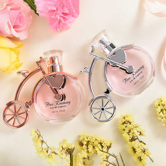 LUNIVA CARE USA unique gift perfume for her in floral bottles shaped like vintage bicycles surrounded by flowers