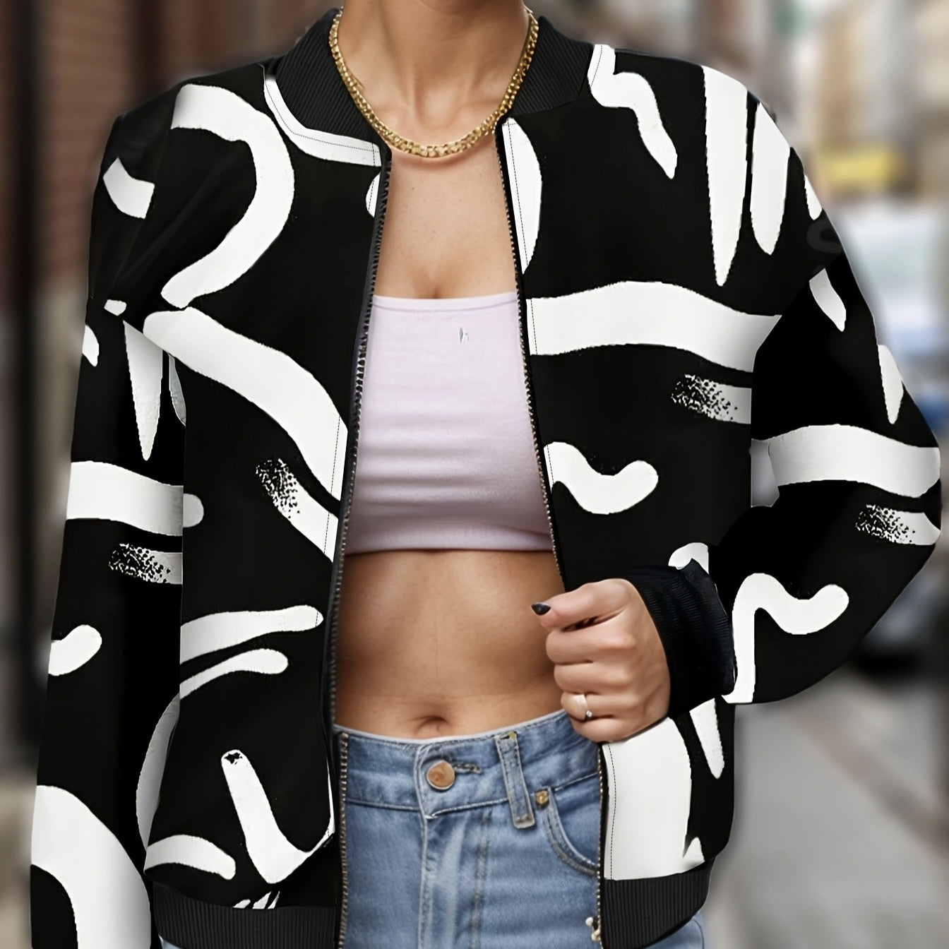 Ladies fashionable printed jacket in black and white abstract design with zipper front