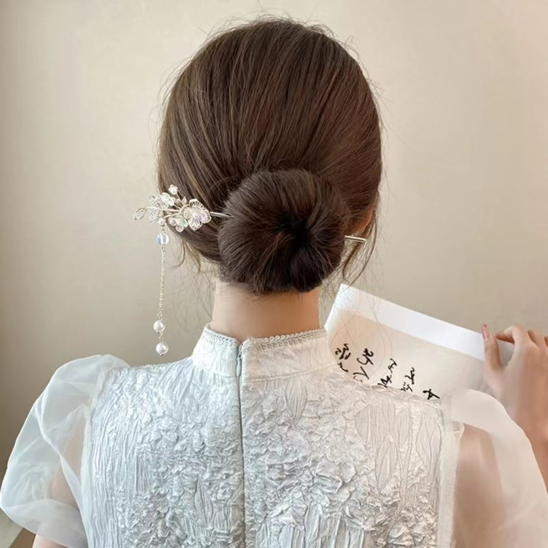 LUNIVA CARE USA luxury hair stick for special occasions adorned with pearls and delicate floral design in elegant updo