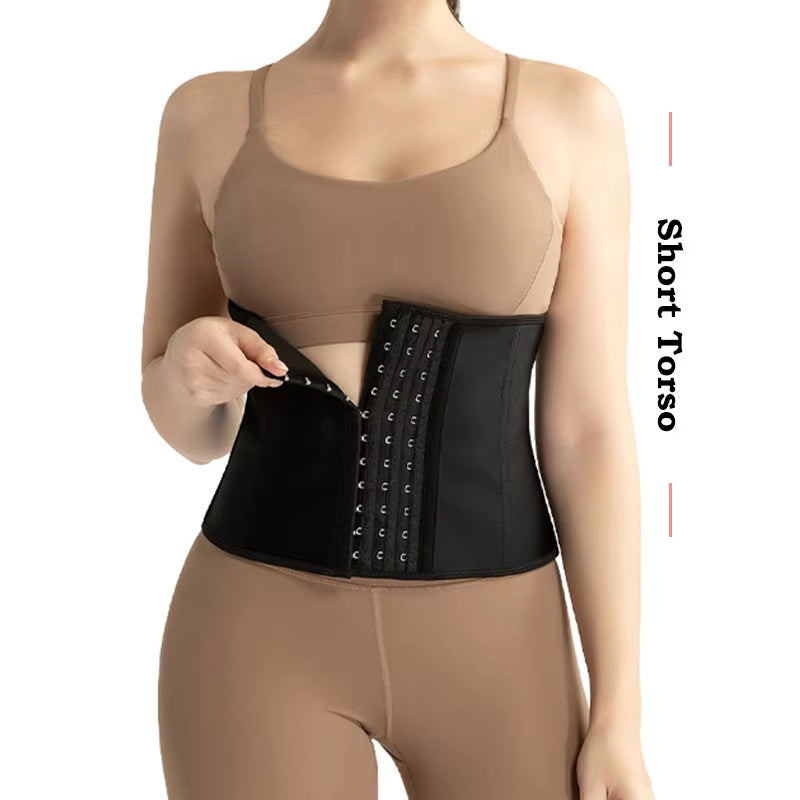 Woman wearing a black short torso waist trainer for women over tan workout clothes