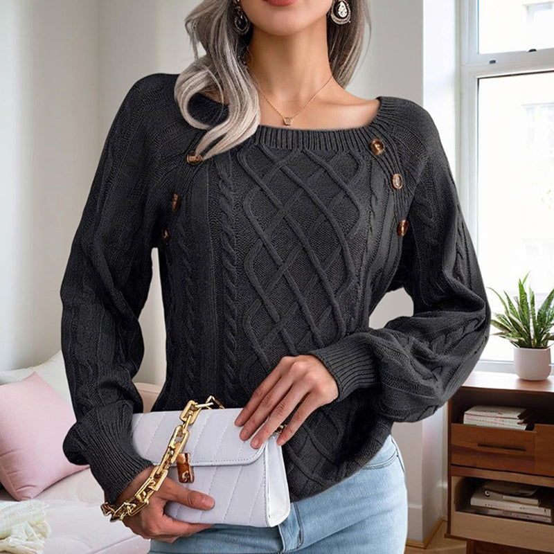 Woman wearing a black solid color pullover sweater women with cable knit design and decorative buttons holding a white purse