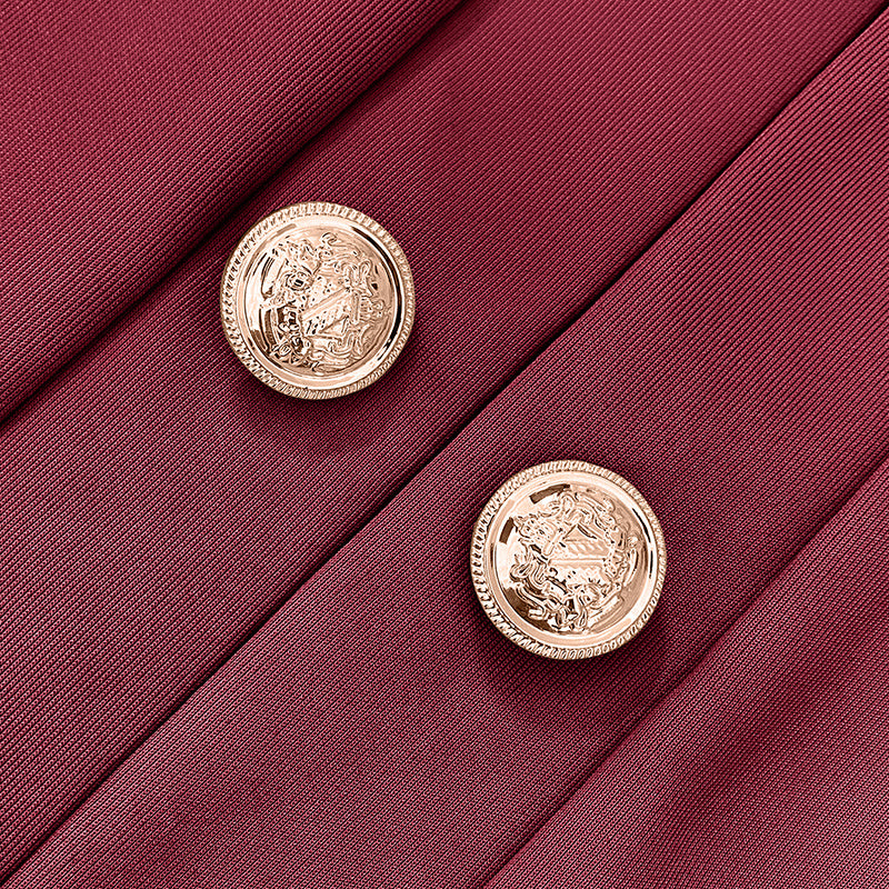 Close-up of gold buttons on burgundy fabric of a plus size women's blazer by LUNIVA CARE USA
