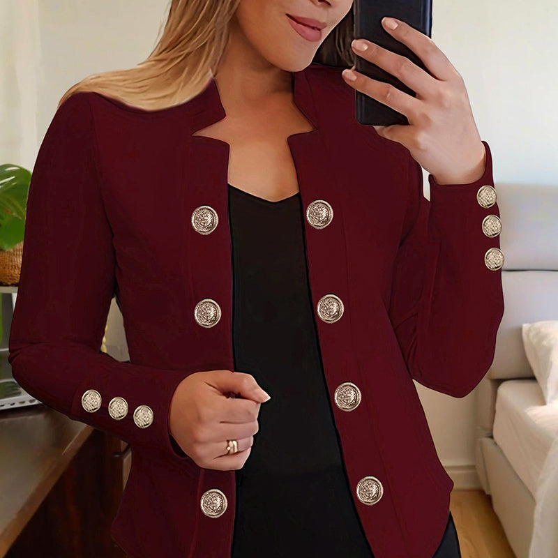 Plus size women's blazer in burgundy with decorative silver buttons worn indoors