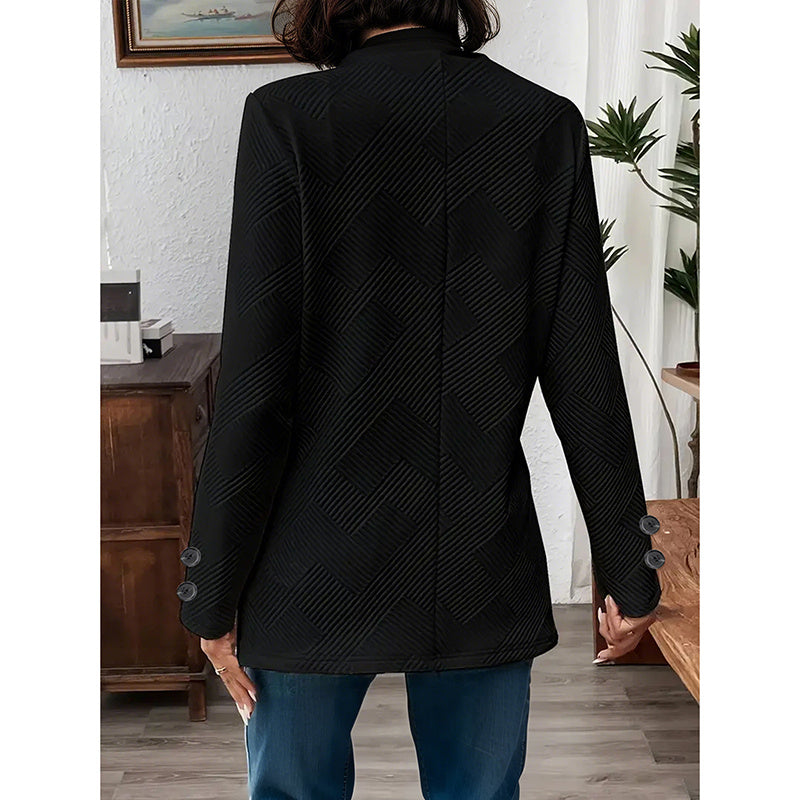 Back view of women's open front blazer jacket in black textured fabric with button details on sleeves