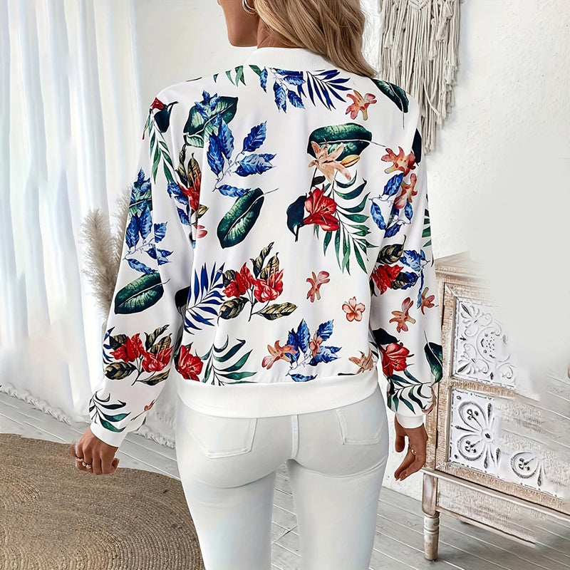 Back view of women's botanical print zip-up jacket with colorful floral patterns and white background