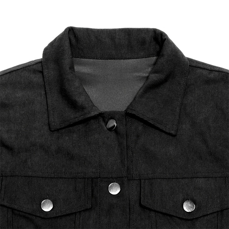 Close-up of black women's corduroy jacket collar and front pockets with silver buttons