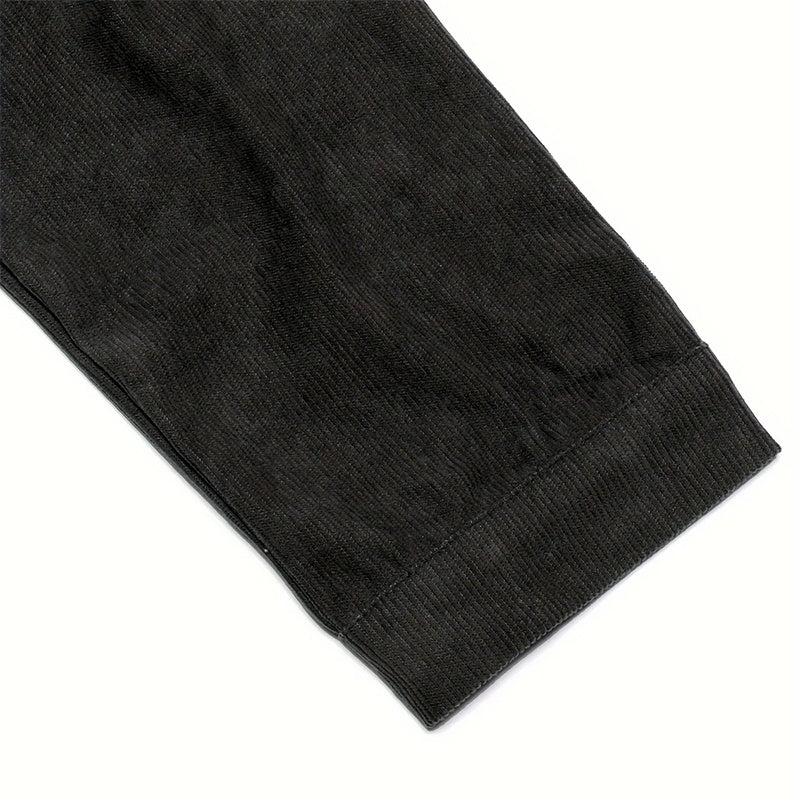 Close-up of black fabric cuff detail on women's corduroy jacket showing texture and stitching