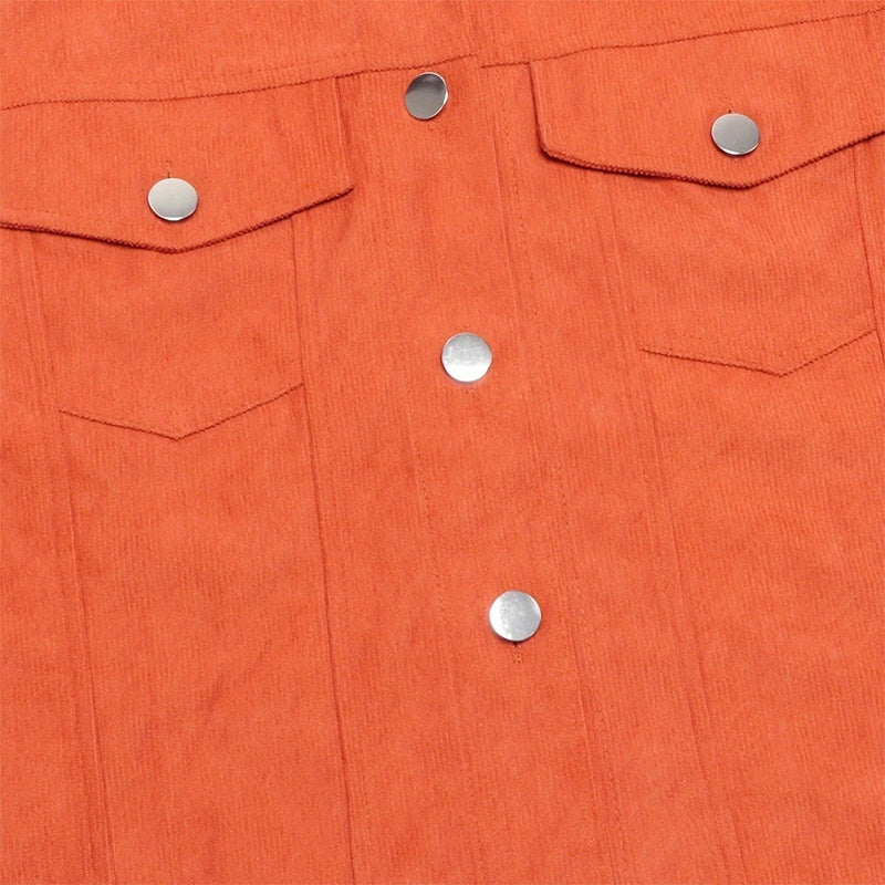Close up of orange women's corduroy jacket with silver snap buttons and chest pockets