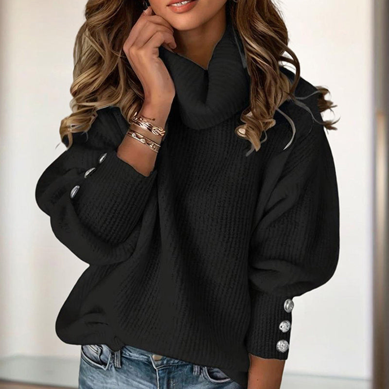Women's high neck sweater in black with button details on sleeves paired with casual jeans