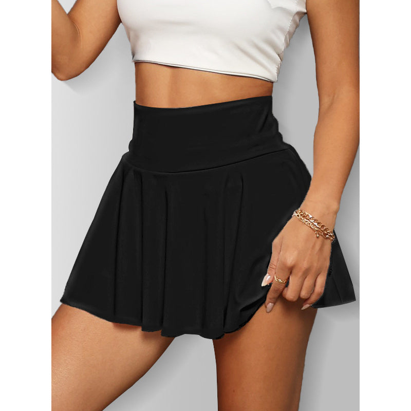 Black women's tennis skirt with pockets paired with white crop top on model