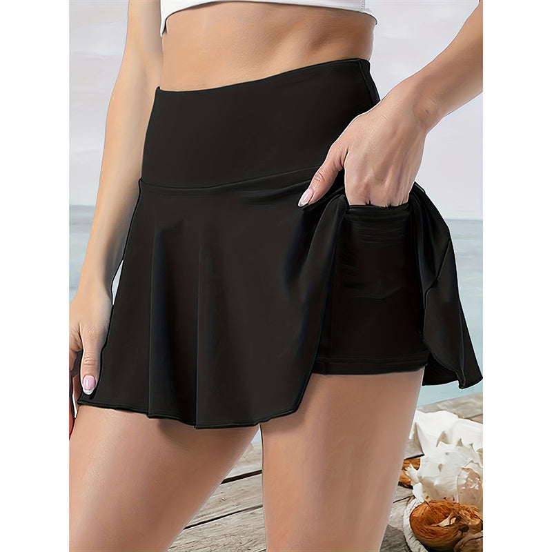 Black women's tennis skirt with pockets featuring a high waist and built-in shorts