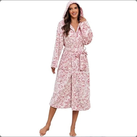 Women wearing a pink hooded women's winter flannel bathrobe with belt and floral pattern