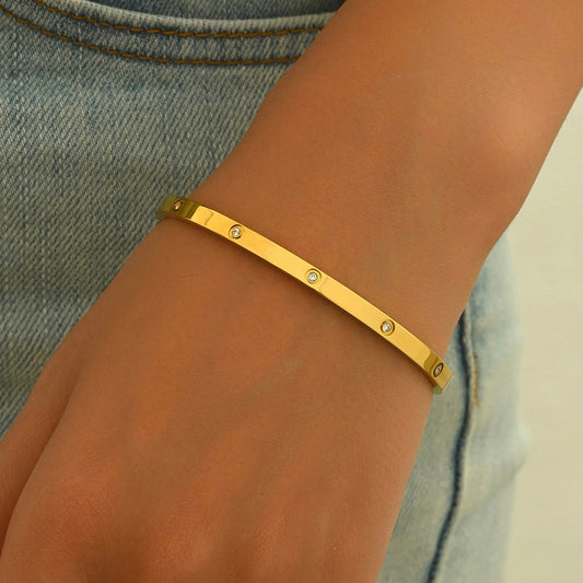 18K gold plated bracelet for women by LUNIVA CARE USA on wrist with small embedded stones