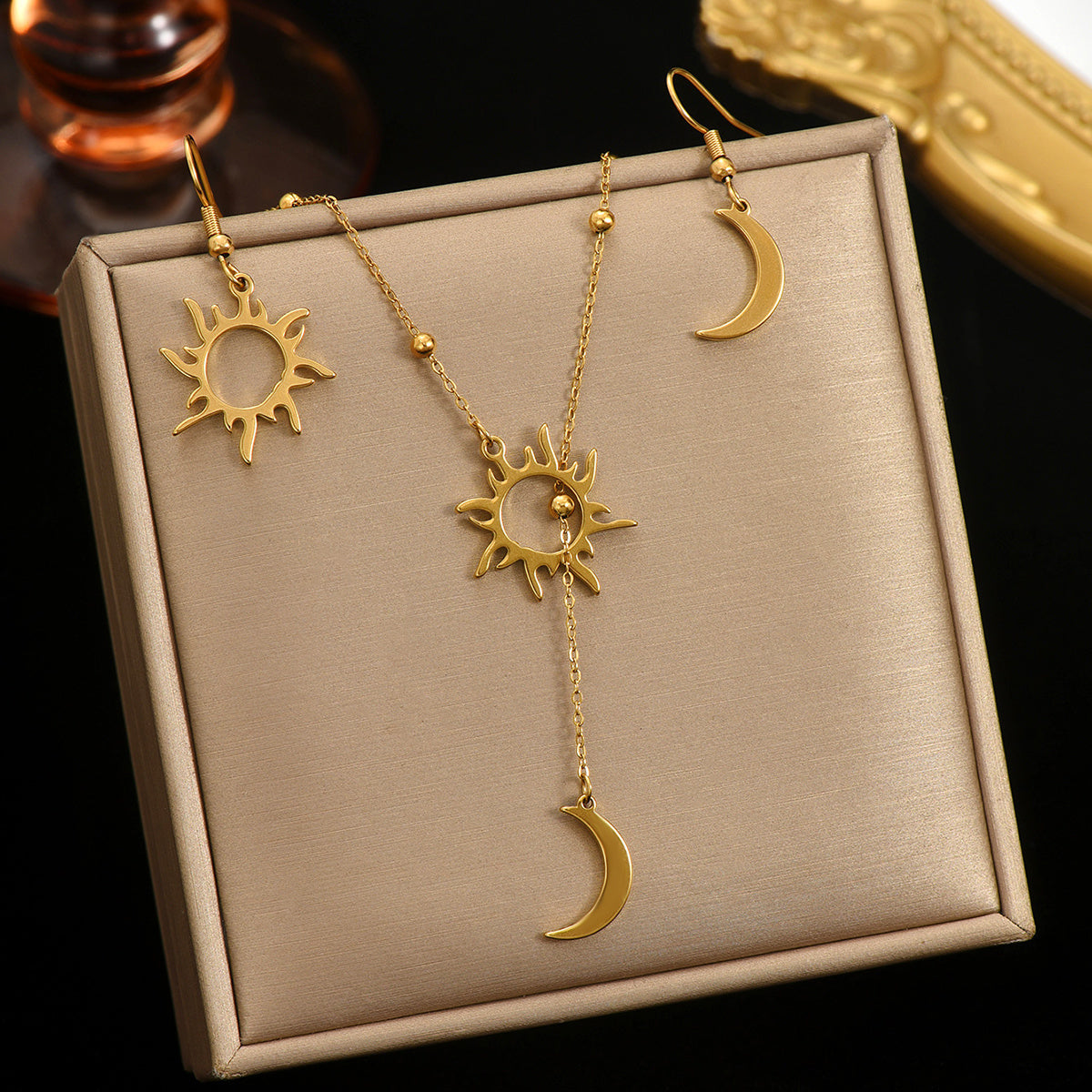 18K gold sun and moon jewelry set featuring sun pendant necklace and matching sun and moon earrings