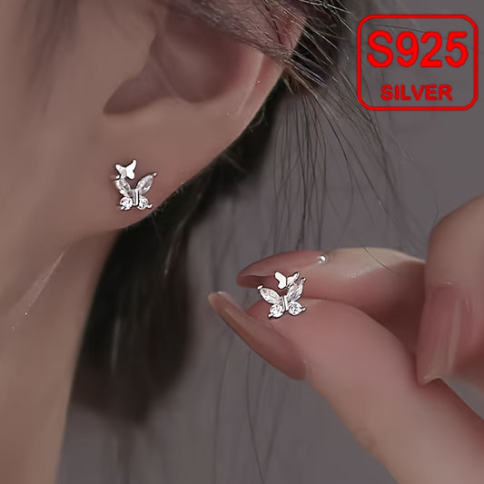 925 silver earrings for sensitive skin butterfly stud earrings worn on ear and held by hand