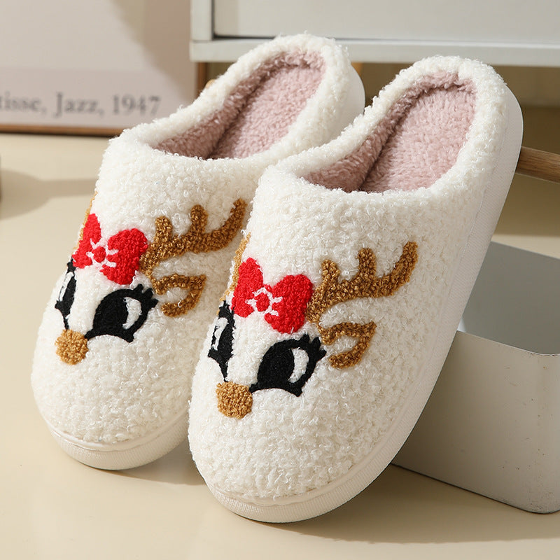 Christmas Santa slippers for couples with white fuzzy material and reindeer face design