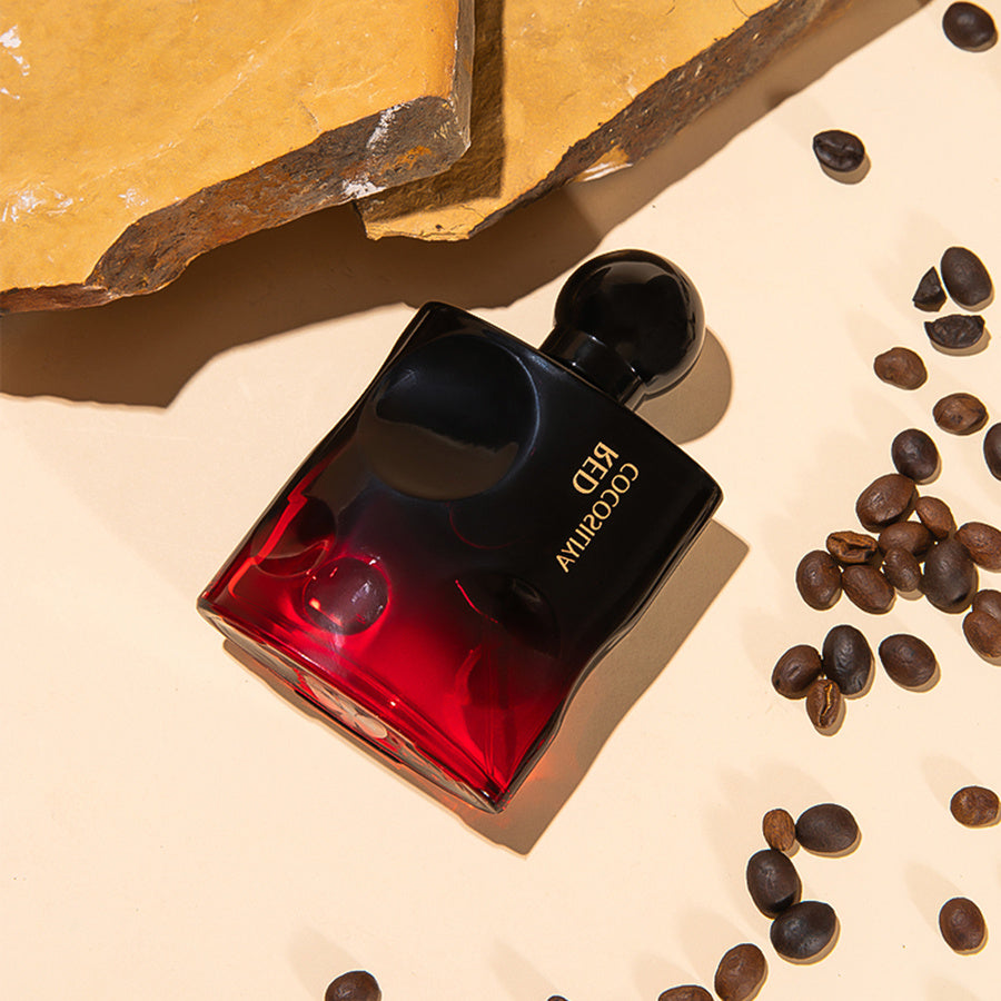 LUNIVA CARE USA red and black bottle of best perfume for seductive presence surrounded by coffee beans