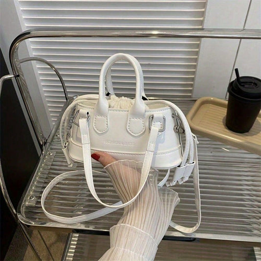 LUNIVA CARE USA elegant top handle clutch bag in white with detachable shoulder strap on a metal chair