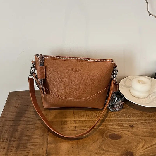 Brown ethnic embroidery shoulder bag with adjustable strap and zipper closure by LUNIVA CARE USA