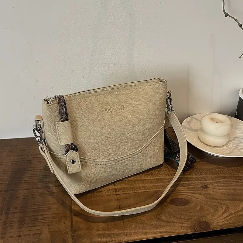 LUNIVA CARE USA ethnic embroidery shoulder bag beige with adjustable strap on wooden surface
