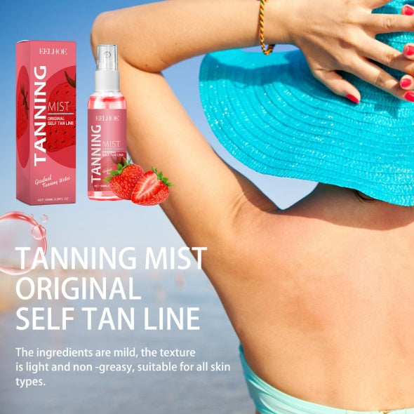 LUNIVA CARE USA strawberry tanning mist bottle and packaging with strawberries beside a woman wearing a blue sunhat