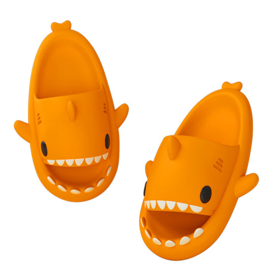 Orange funny shark slippers for adults with cartoon shark face and fins in slip-on style