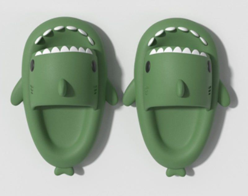 Green funny shark slippers for adults with open mouth design and cartoonish features