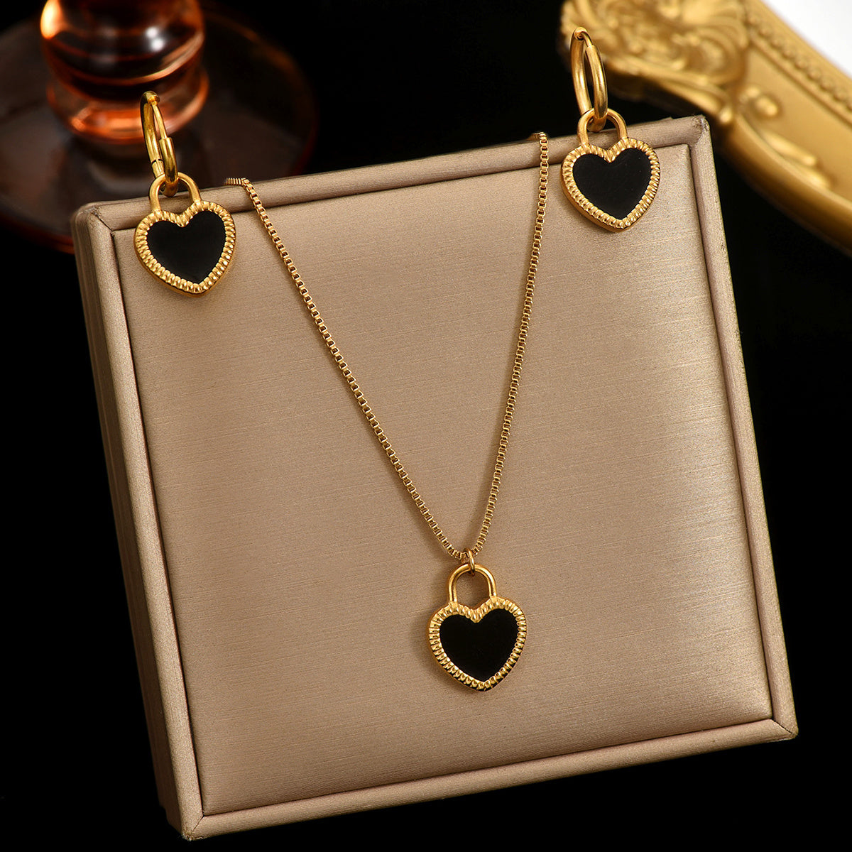 Gold heart pendant necklace for women with matching heart-shaped earrings jewelry set
