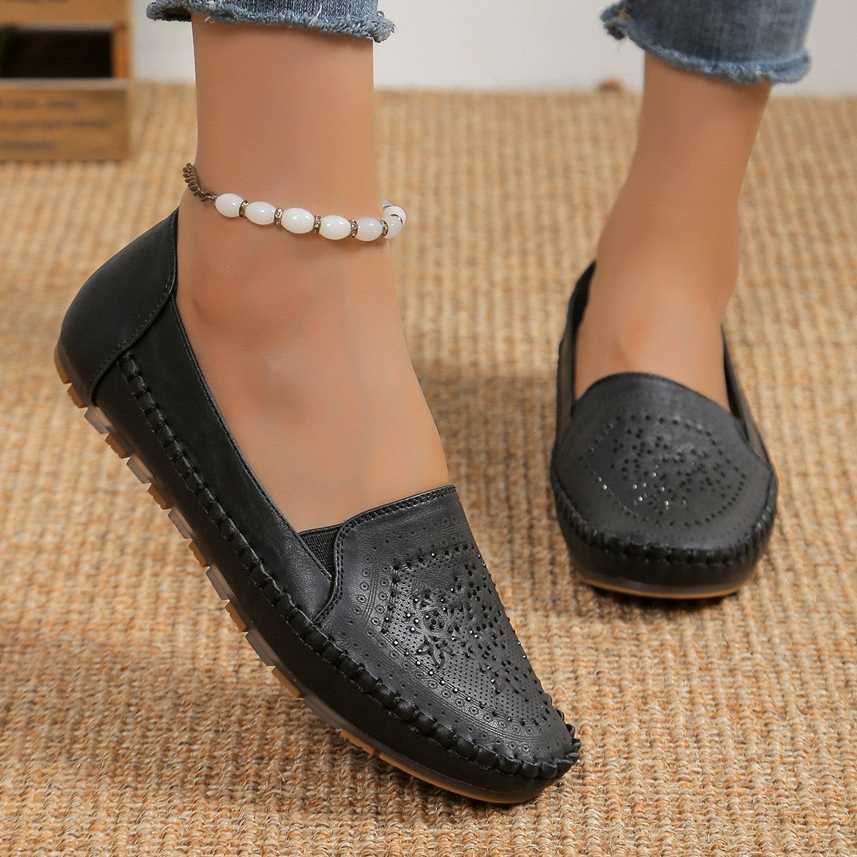 Black leather handmade women's casual shoes with perforated design and comfortable sole