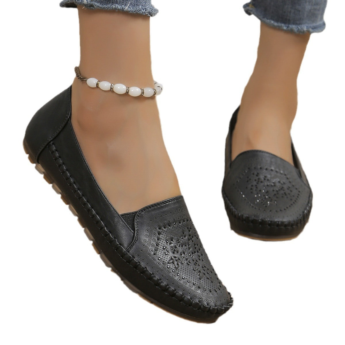 Black leather handmade women's casual shoes with perforated gothic design and stitched detailing