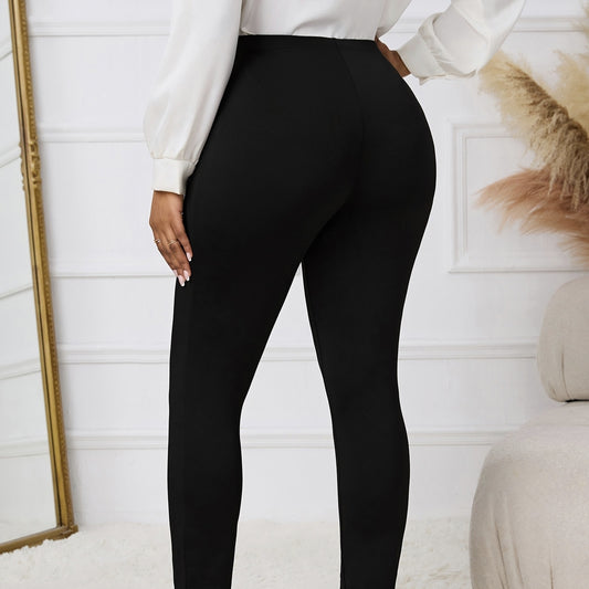 Back view of black ladies slimming pants with slit styled with white blouse in a modern room