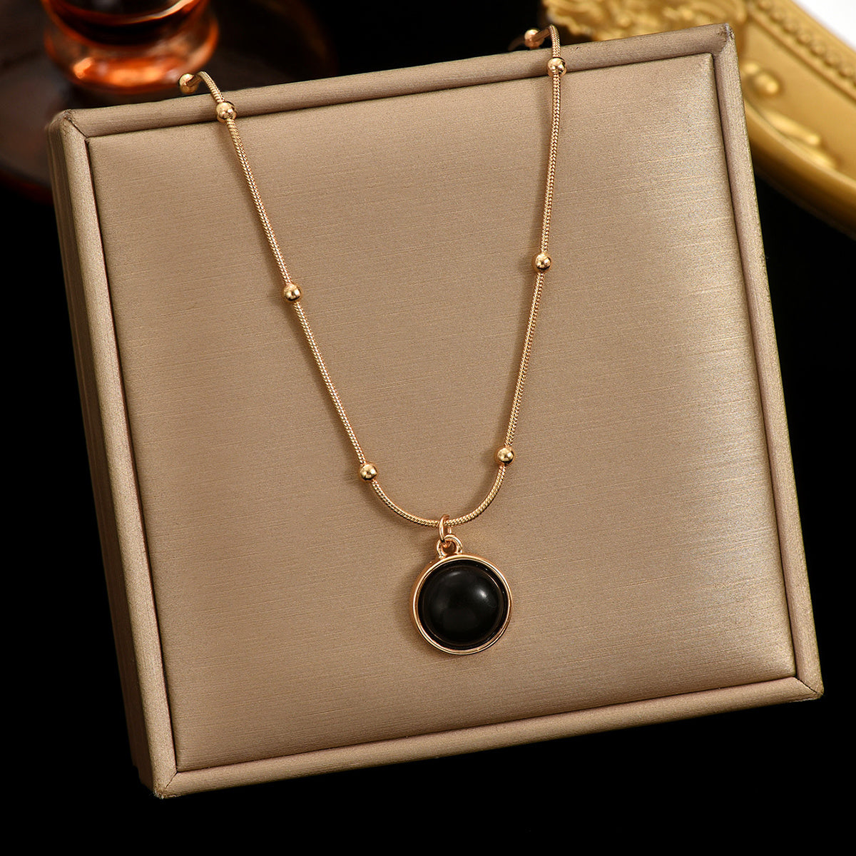 Luxury self-care necklace women with black pendant on gold chain by LUNIVA CARE USA