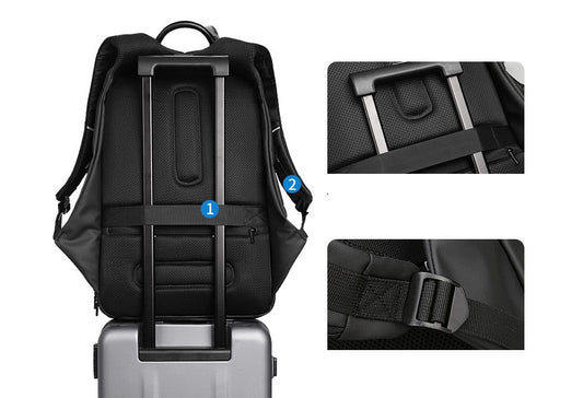 Black Oxford cloth laptop backpack with padded back and adjustable straps shown on luggage handle