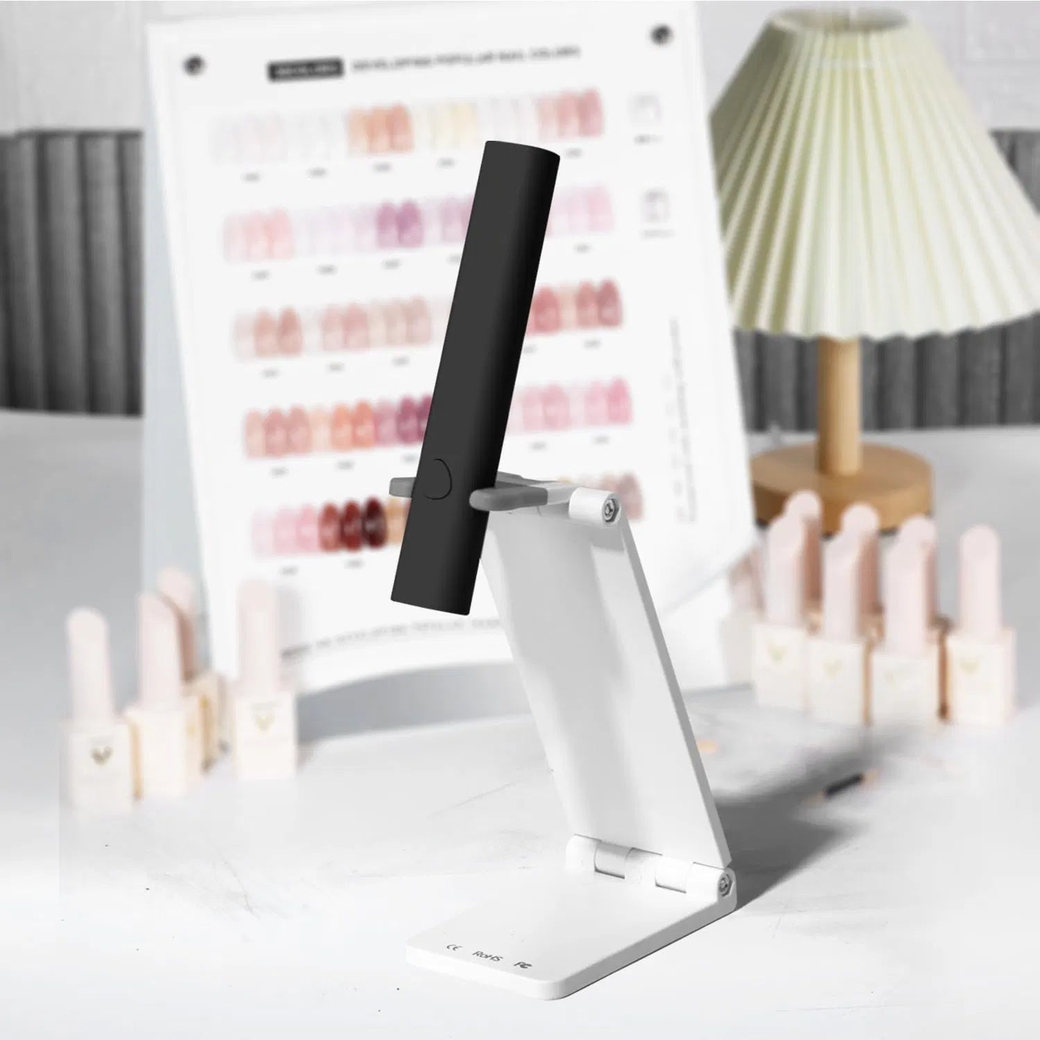 LUNIVA CARE USA mini UV LED nail lamp with adjustable black and white design on a table