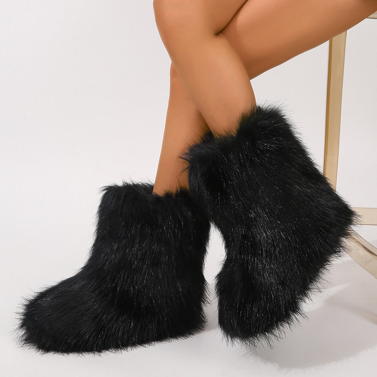 Black furry personalized winter boots for women shown worn on legs with soft plush texture
