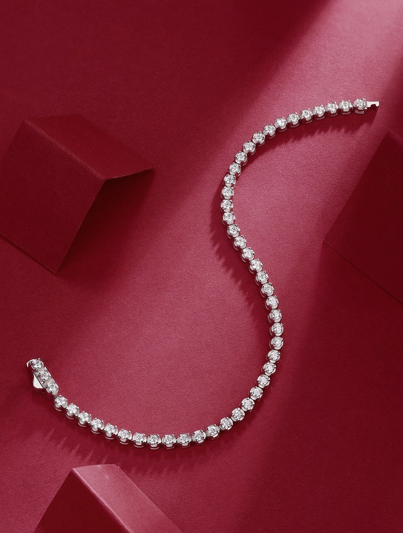 LUNIVA CARE USA S925 fine jewelry bracelet with sparkling moissanite stones on a red background