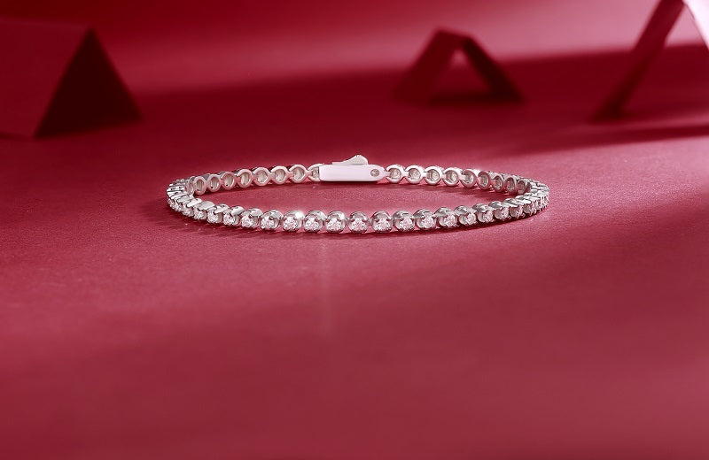 LUNIVA CARE USA S925 fine jewelry bracelet with sparkling moissanite stones on red background