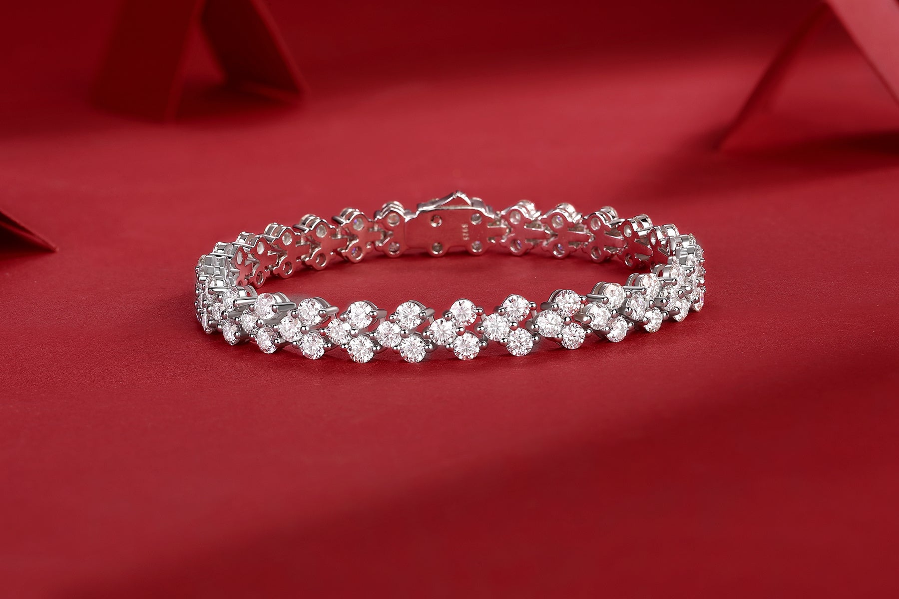 LUNIVA CARE USA S925 silver moissanite bracelet with sparkling stones on red background