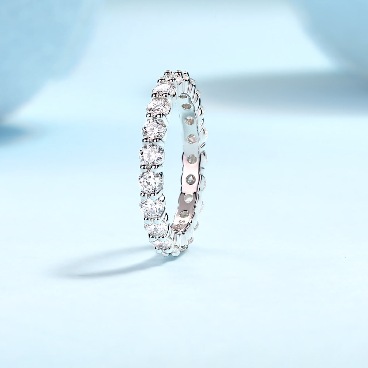 Elegant 925 sterling silver moissanite ring with sparkling round stones in eternity band style