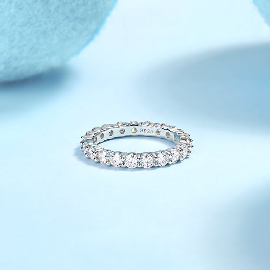 LUNIVA CARE USA 925 sterling silver moissanite ring with sparkling round stones on light blue background