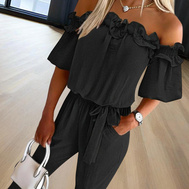Elegant off-shoulder jumpsuit for women in black with ruffle details and a waist tie belt