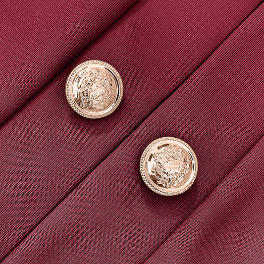 Close-up of gold buttons on burgundy fabric of a plus size women's blazer by LUNIVA CARE USA