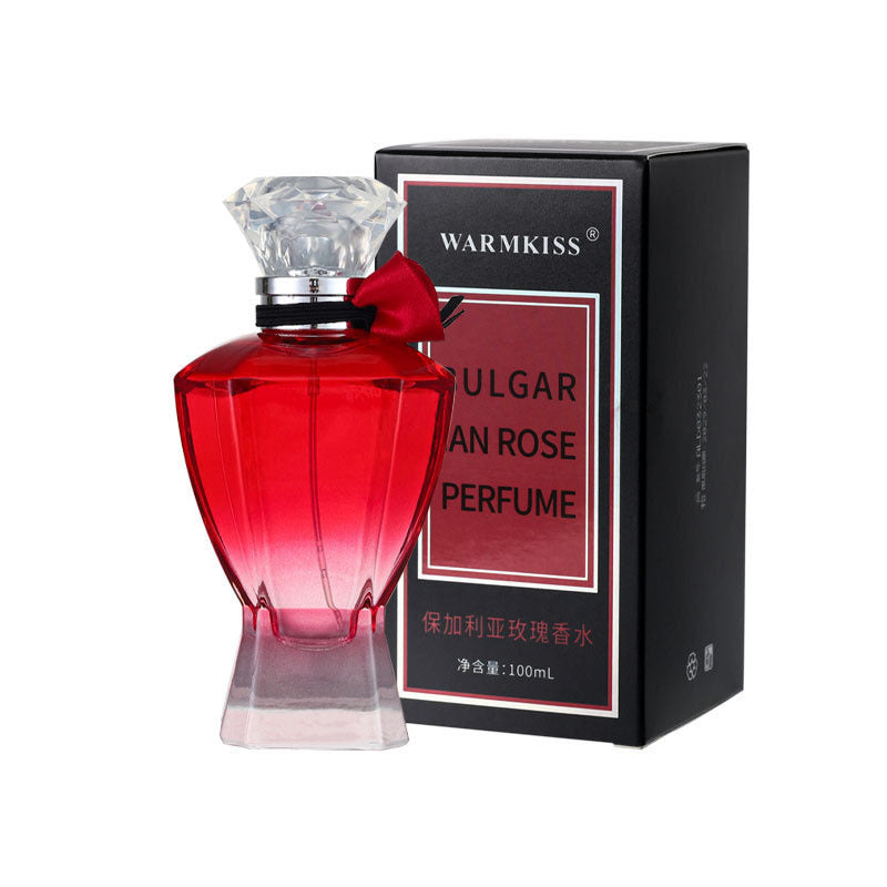 Giftable luxury perfume for her in a red glass bottle with a crystal cap and black box packaging