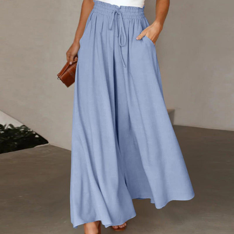 Light blue women's high waist wide leg pants with drawstring and pockets styled with a white top