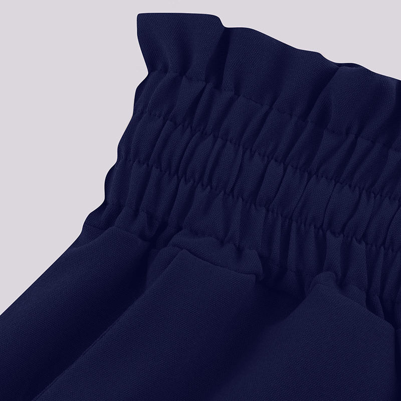Close-up of navy blue fabric with elastic waistband detail for women's high waist wide leg pants
