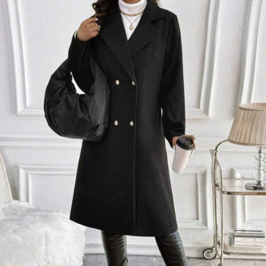 Black women's long sleeve knit jacket with double-breasted buttons styled with black bag and white turtleneck