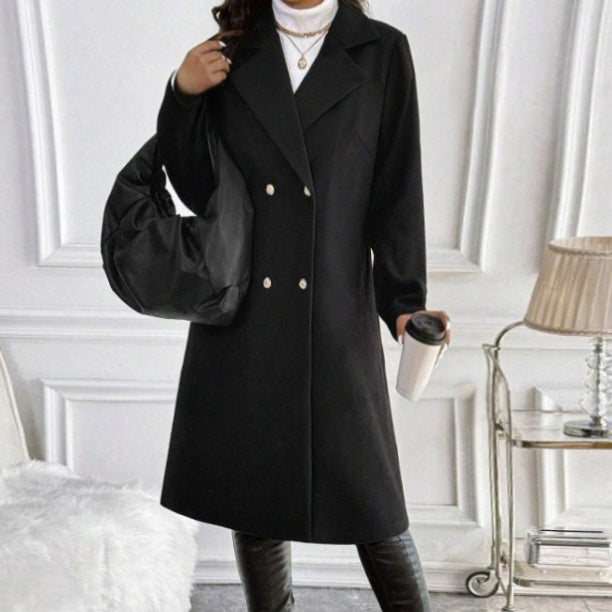 Black women's long sleeve knit jacket styled with white turtleneck and black bag