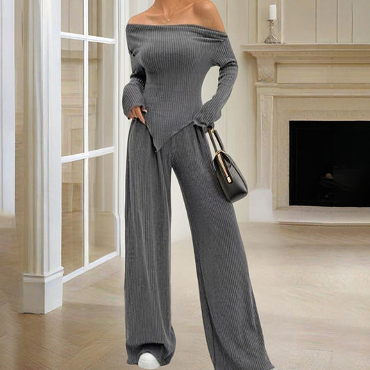 Gray ribbed women's off-shoulder lounge set with wide-leg pants and long sleeves indoors
