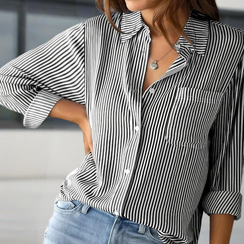 Black and white women's striped button-up shirt with front pocket and rolled sleeves